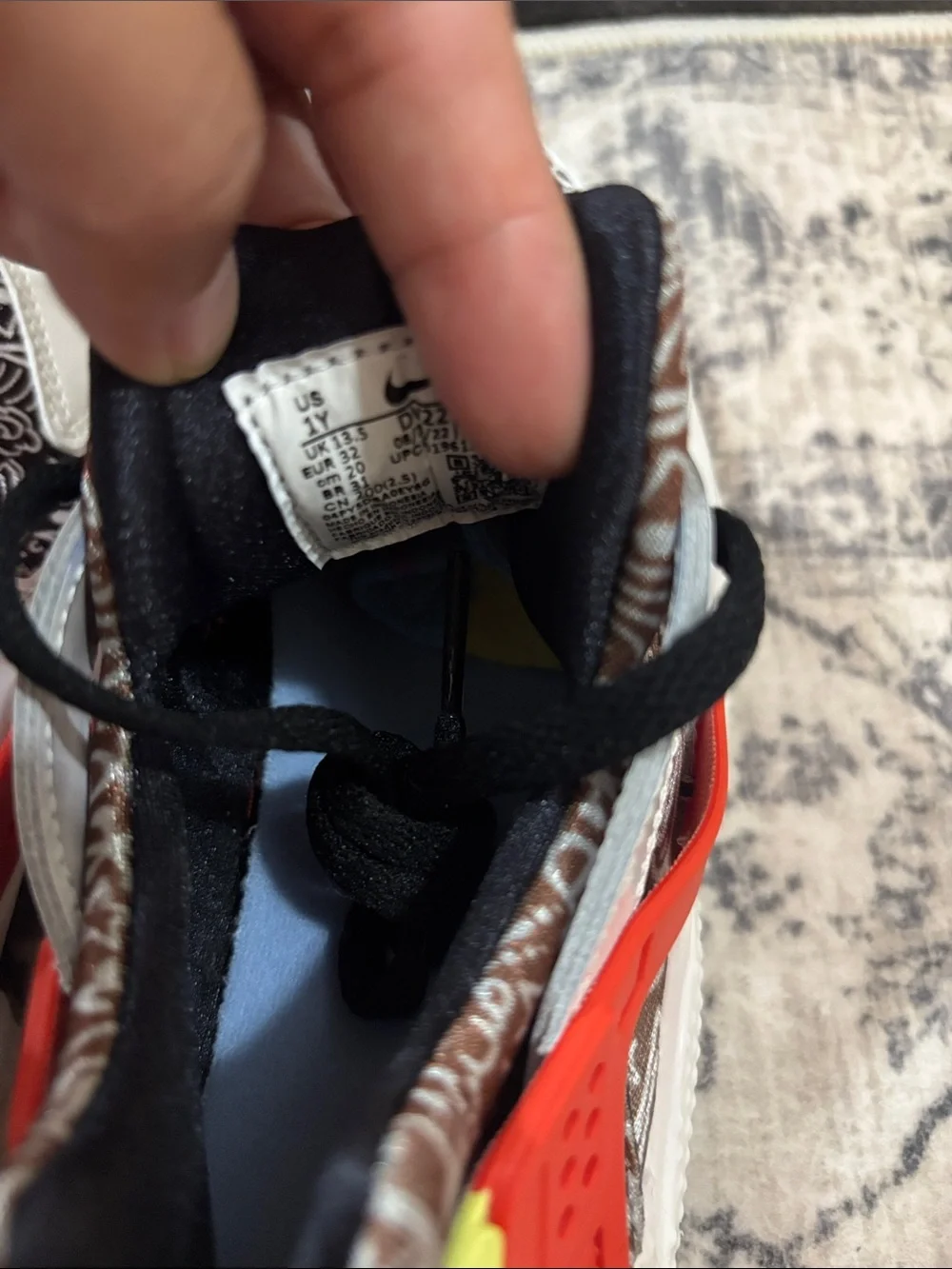 Nike Huarache Kids White Sneakers with Black Pattern, Orange & Yellow Accents